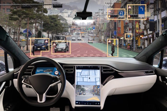 The interior of an autonomous driverless vehicle. Courtesy Adobe.